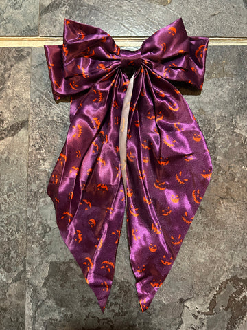 Purple with jack o lantern face bow